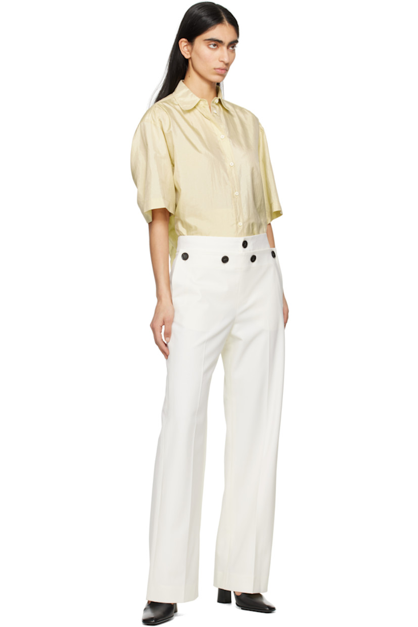 Straight-leg stretch virgin wool-blend gabardine trousers.

· Low-rise
· Three-pocket styling
· Zip-fly
· Buttoned fold-down panel at front
· Creased legs
· Belt loops and darts at back waistband 

Supplier color: Off white