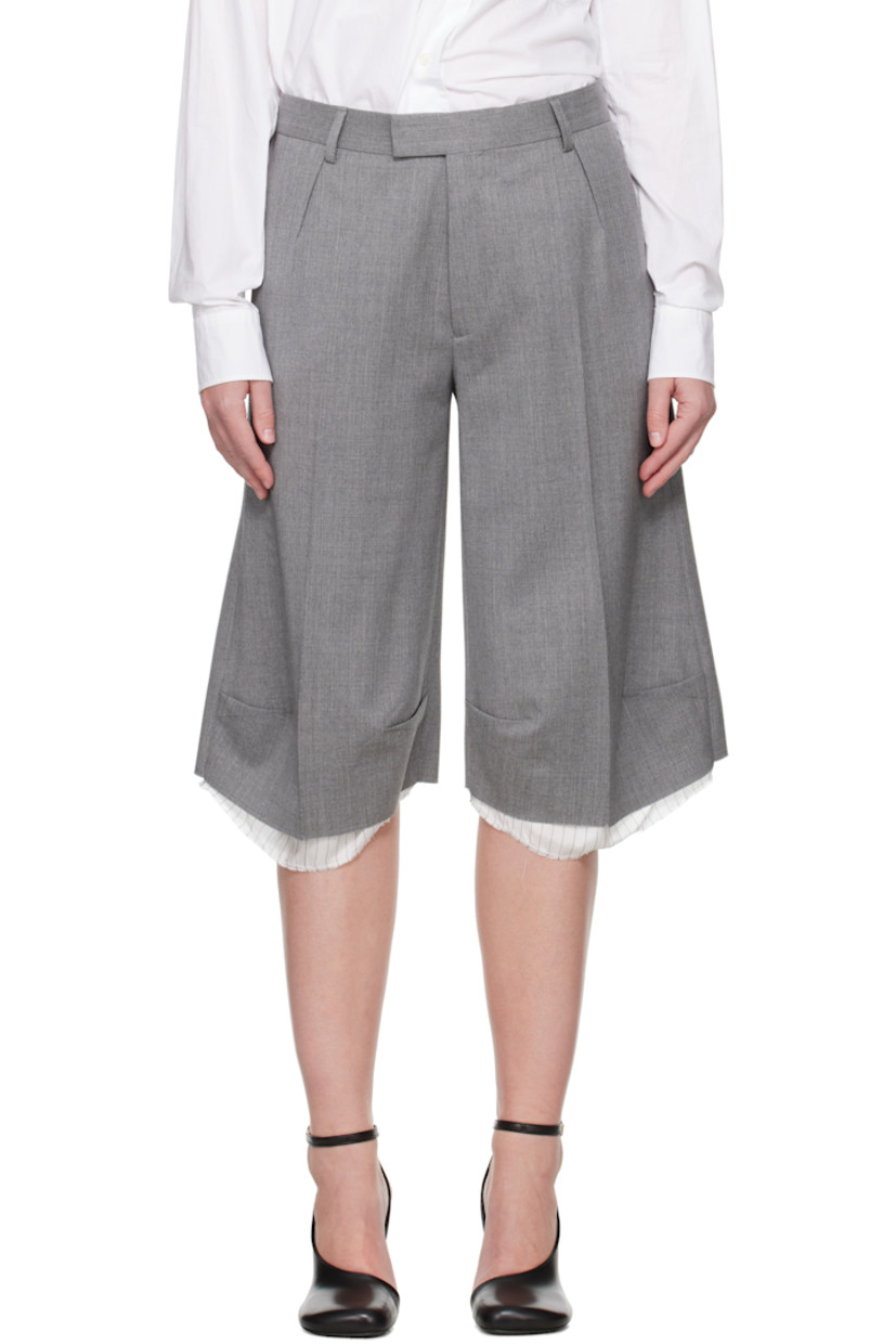 Stretch virgin wool delaine shorts.

· Belt loops
· Four-pocket styling
· Zip fly
· Darts at front
· Creased legs
· Exposed lining with raw edge at cuffs
· Partial viscose satin lining

Supplier color: Grey