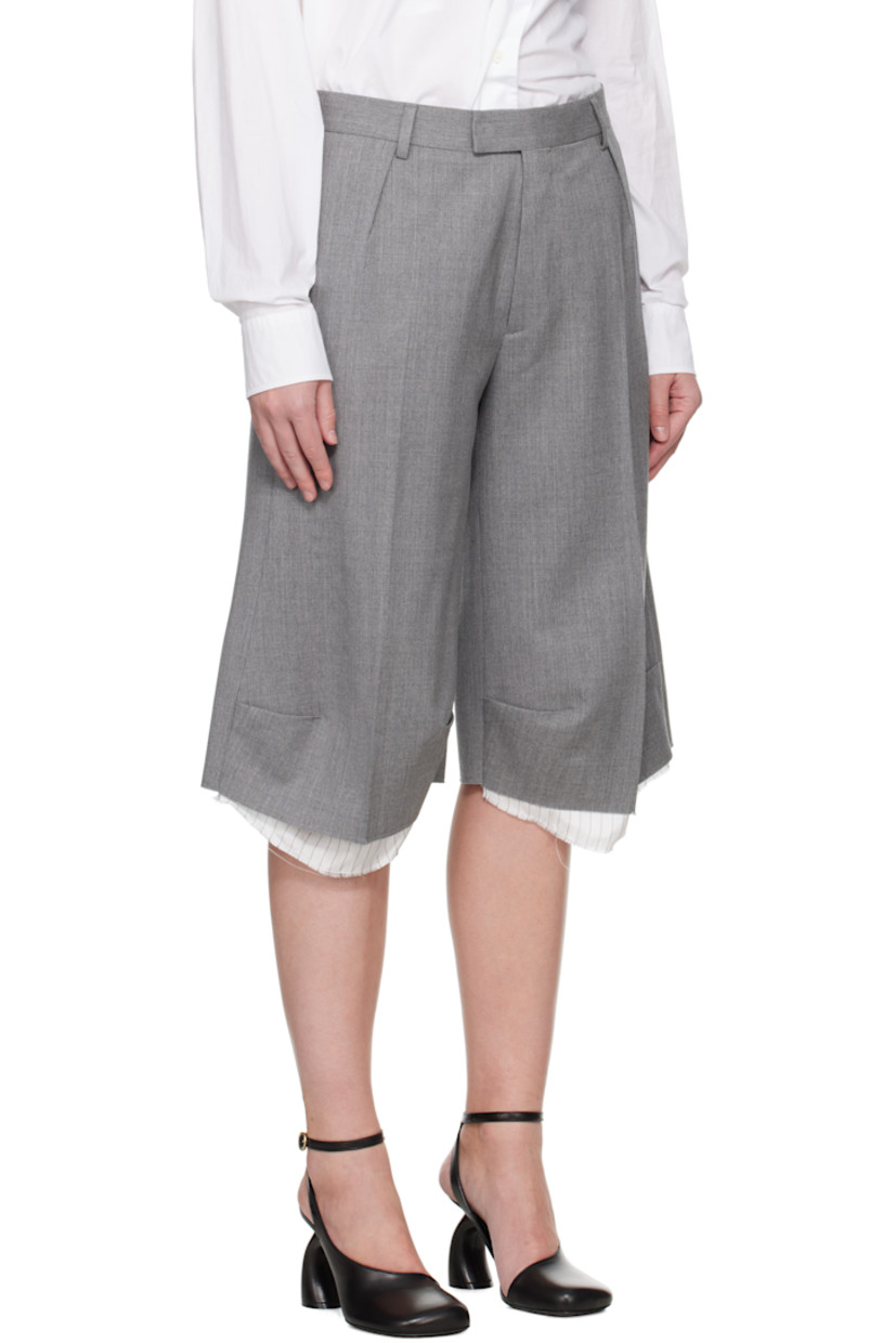 Stretch virgin wool delaine shorts.

· Belt loops
· Four-pocket styling
· Zip fly
· Darts at front
· Creased legs
· Exposed lining with raw edge at cuffs
· Partial viscose satin lining

Supplier color: Grey