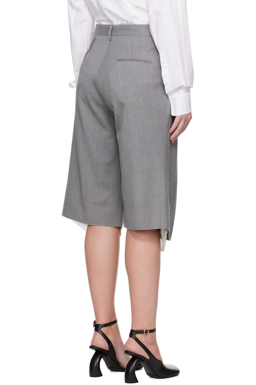 Stretch virgin wool delaine shorts.

· Belt loops
· Four-pocket styling
· Zip fly
· Darts at front
· Creased legs
· Exposed lining with raw edge at cuffs
· Partial viscose satin lining

Supplier color: Grey