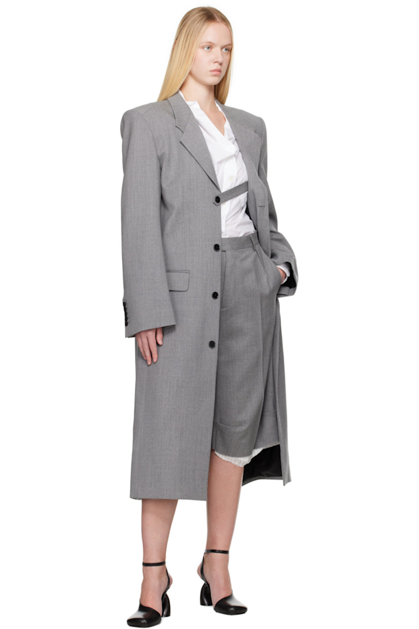 Stretch virgin wool delaine shorts.

· Belt loops
· Four-pocket styling
· Zip fly
· Darts at front
· Creased legs
· Exposed lining with raw edge at cuffs
· Partial viscose satin lining

Supplier color: Grey