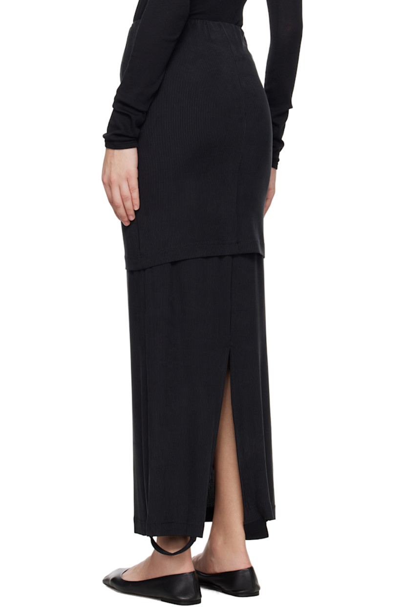 Stretch cupro rib-knit jersey maxi skirt.

· Elasticized waistband
· Logo-woven elasticized trim at tiered hem
· Slit at back hem

Supplier color: Black
