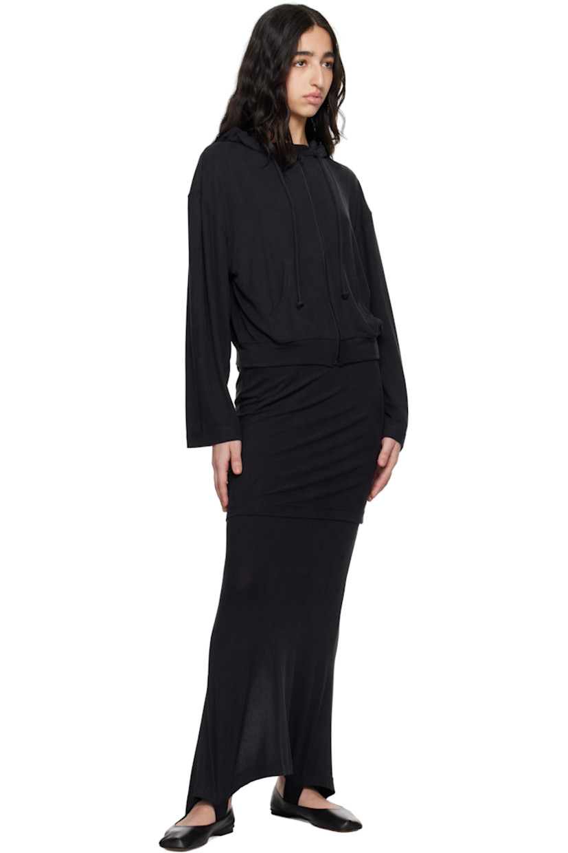 Stretch cupro rib-knit jersey maxi skirt.

· Elasticized waistband
· Logo-woven elasticized trim at tiered hem
· Slit at back hem

Supplier color: Black