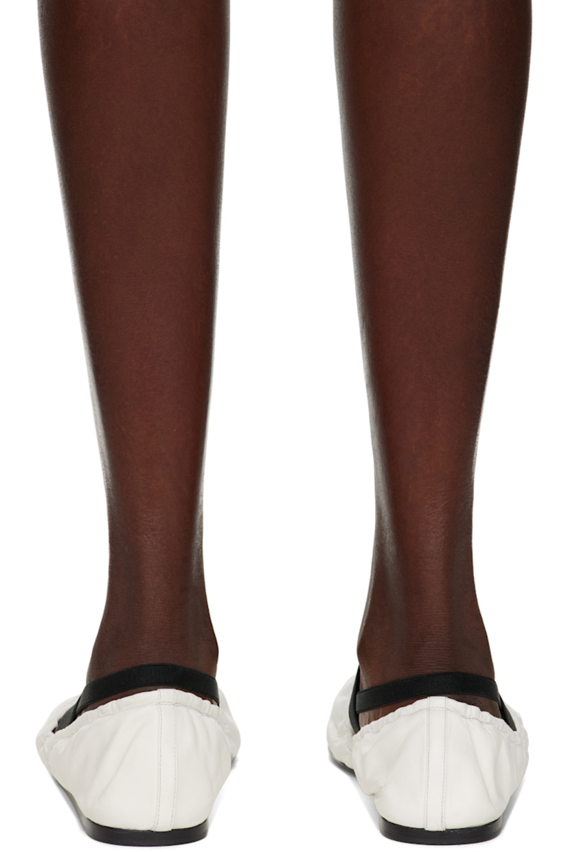 Buffed lambskin Mary Jane-style ballerina flats in white.

· Elasticized collar
· Elasticized straps at vamp
· Rubber heel
· Leather sole

Supplier color: White