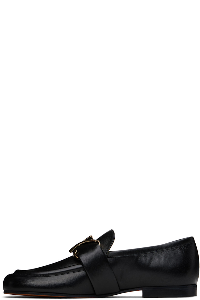 Buffed leather loafers in black.

· Moc toe
· Strap with logo hardware at vamp
· Stacked leather heel with rubber injection
· Leather sole

Supplier color: Black
