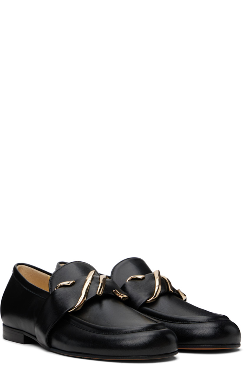 Buffed leather loafers in black.

· Moc toe
· Strap with logo hardware at vamp
· Stacked leather heel with rubber injection
· Leather sole

Supplier color: Black
