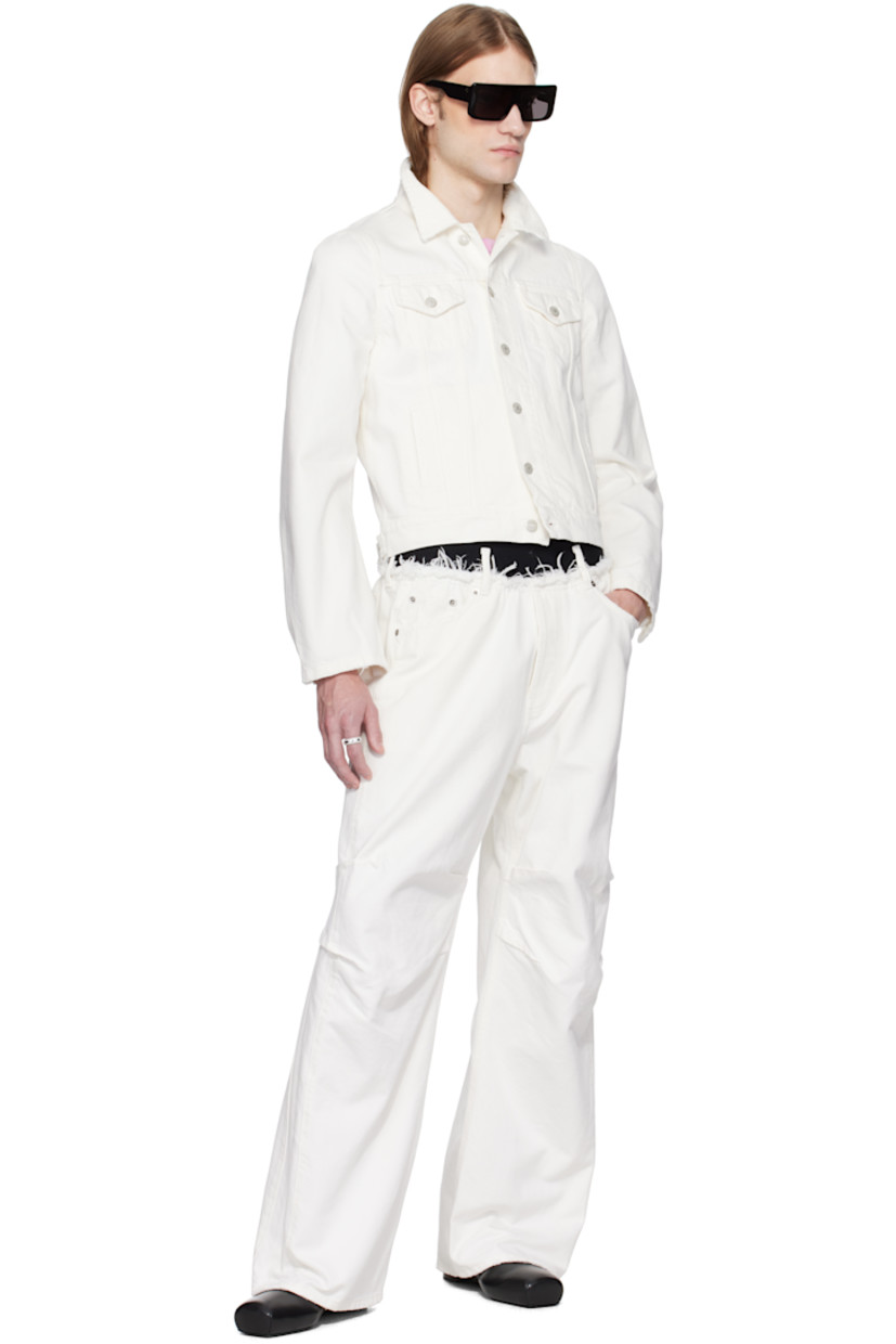 Non-stretch denim jacket. Subtle distressing throughout.

· Spread collar
· Button closure
· Flap and welt pockets
· Dart at shoulders
· Button fastening at cuffs
· Adjustable button tabs at back hem
· Unlined
· Logo-engraved antiqued silver-tone hardware

Supplier color: White wash