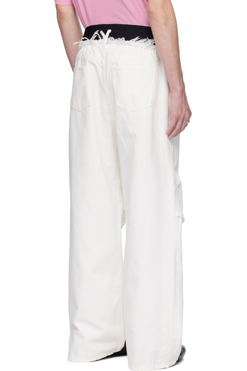 Non-stretch denim jeans. Subtle distressing throughout.

· Belt loops
· Frayed edge at logo-woven elasticized waistband
· Five-pocket styling
· Button fly
· Tucks at knees
· Logo-engraved antiqued silver-tone hardware

Supplier color: White wash