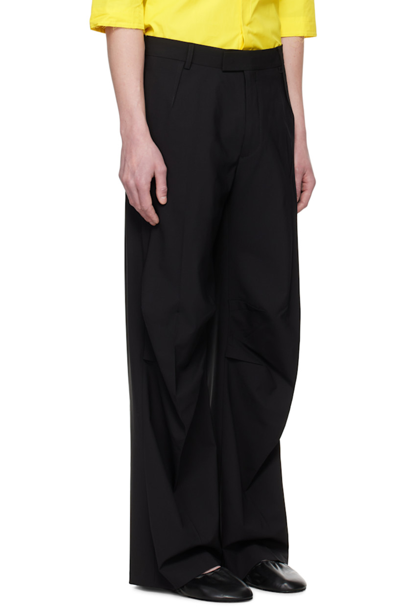 Plain-woven stretch virgin wool-blend trousers.

· Belt loops
· Three-pocket styling
· Zip fly
· Pleats at front and back
· Creased legs
· Tucks at knees

Supplier color: Black