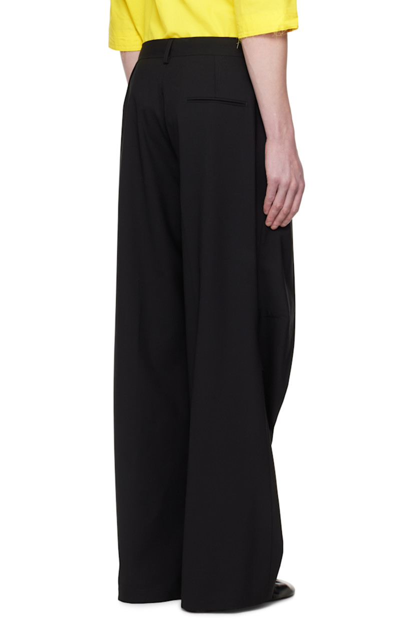 Plain-woven stretch virgin wool-blend trousers.

· Belt loops
· Three-pocket styling
· Zip fly
· Pleats at front and back
· Creased legs
· Tucks at knees

Supplier color: Black