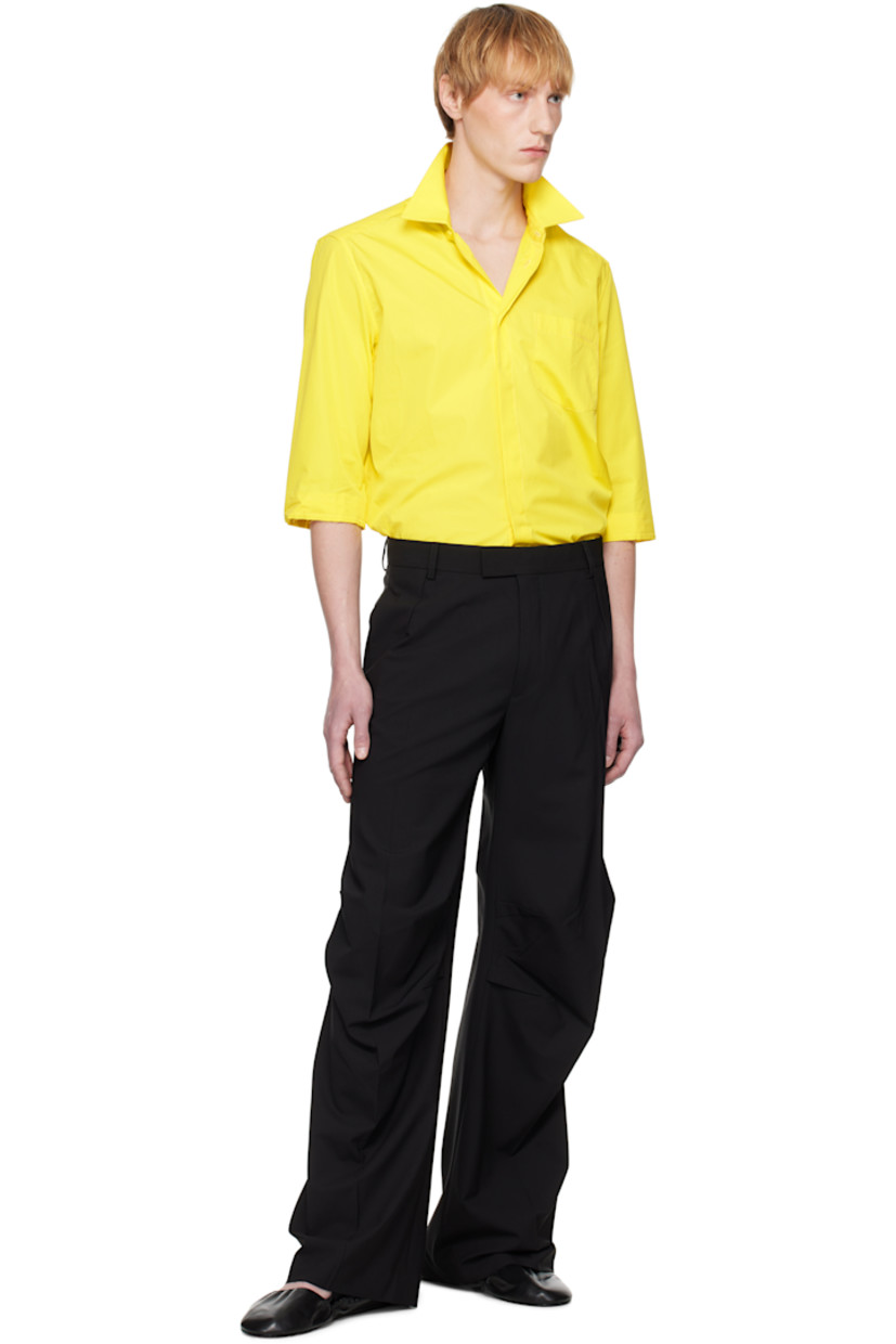 Plain-woven stretch virgin wool-blend trousers.

· Belt loops
· Three-pocket styling
· Zip fly
· Pleats at front and back
· Creased legs
· Tucks at knees

Supplier color: Black