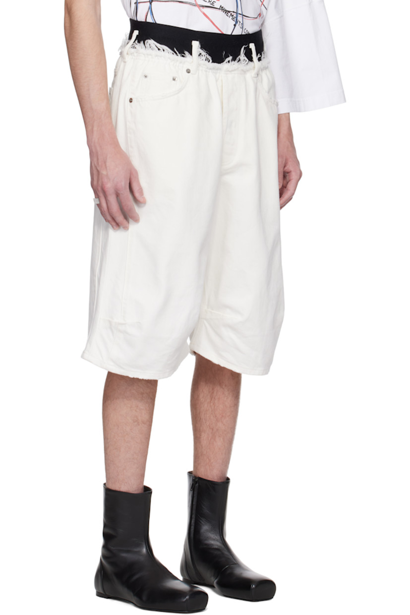 Non-stretch denim shorts. Subtle distressing throughout.

· Belt loops
· Frayed edge at logo-woven elasticized waistband
· Five-pocket styling
· Button fly
· Tucks at front legs
· Logo-engraved antiqued silver-tone hardware

Supplier color: White wash