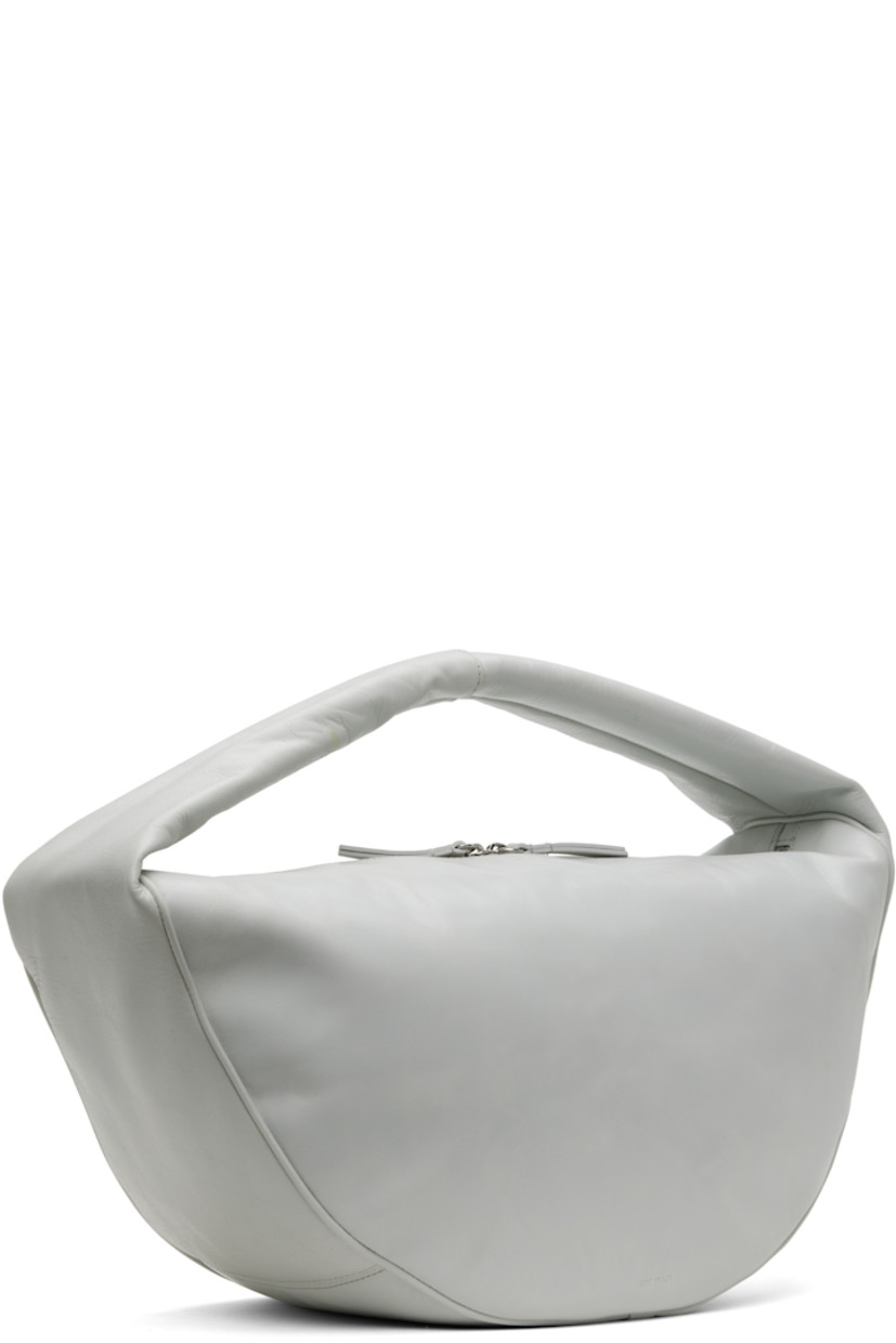 Crinkled calfskin shoulder bag in gray.

· Integrated rolled shoulder strap
· Two-way zip closure
· Zip pocket at interior
· Cotton twill lining
· H11" x W18" x D7"

Supplier color: Burrata