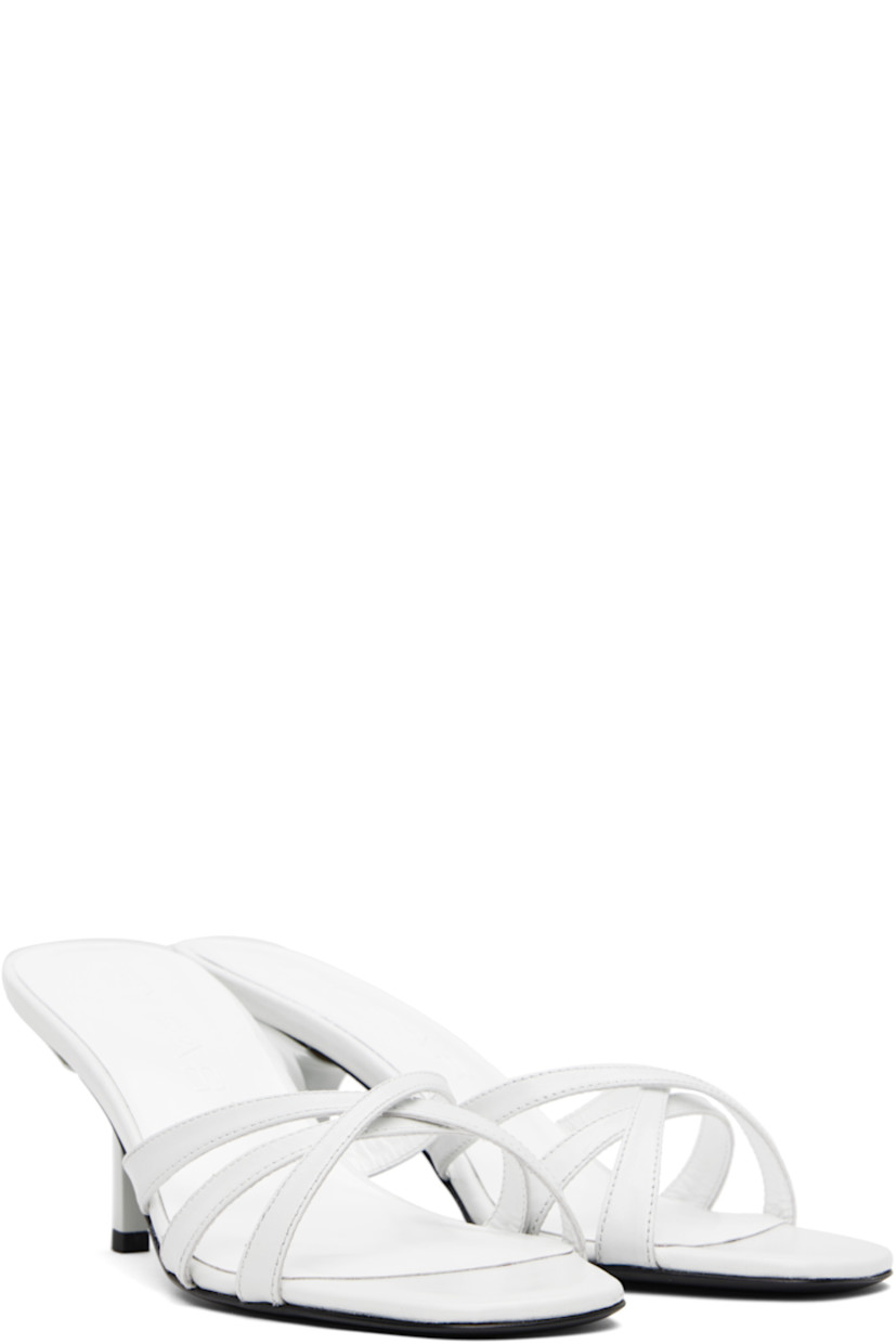 Creased calfskin heeled sandals in white. 

· Open toe
· Crisscrossing straps at vamp
· Logo embossed at molded footbed
· Covered heel with rubber injection
· Polished leather sole
· Heel: H3"

Supplier color: Burrata
