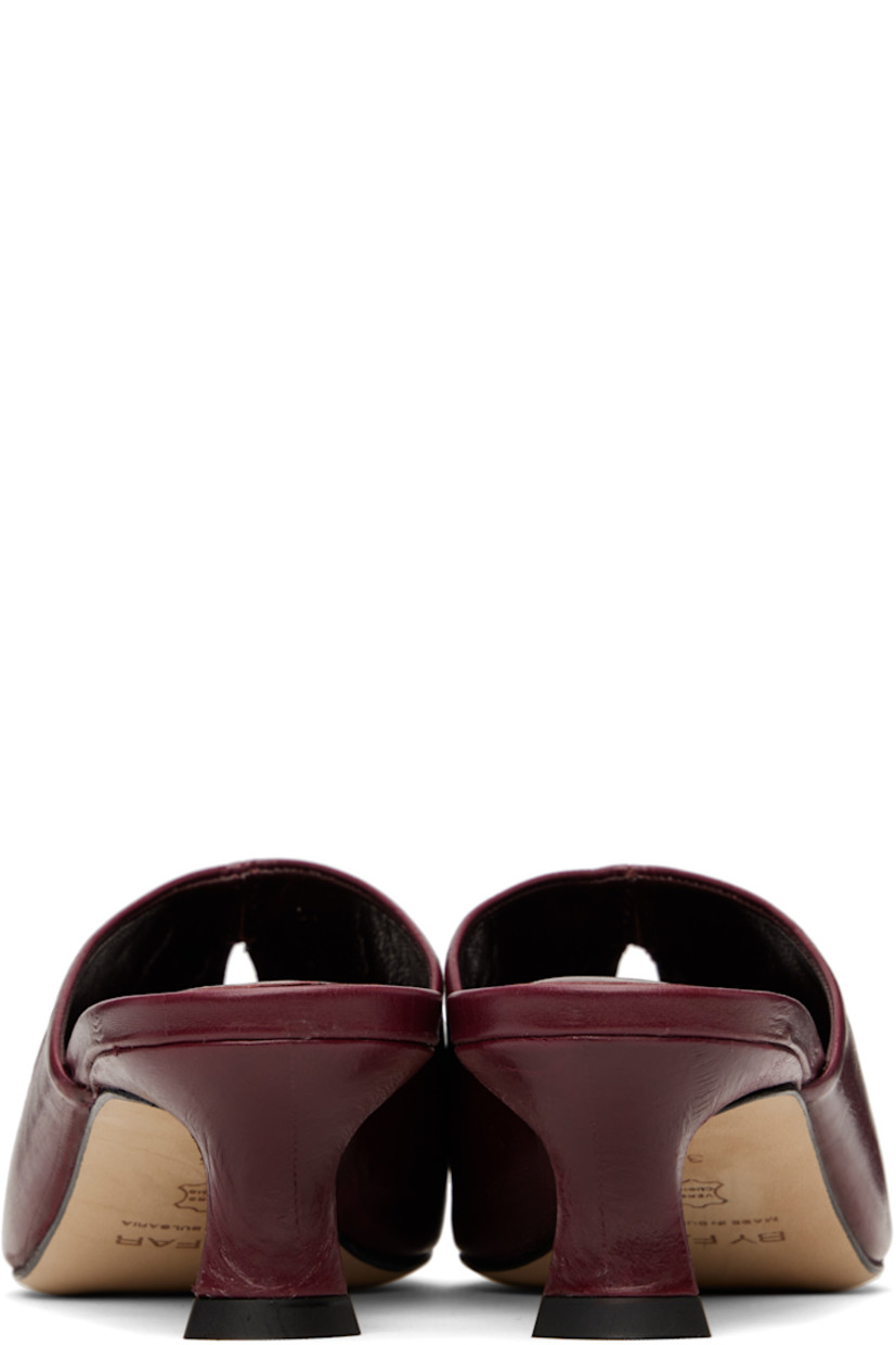 Eel-embossed lambskin mules in burgundy.

· Pointed toe
· Cutout at vamp
· Covered kitten heel with rubber injection
· Logo embossed at footbed
· Nubuck sole
· Heel: H2.25"

Supplier color: Sour cherry