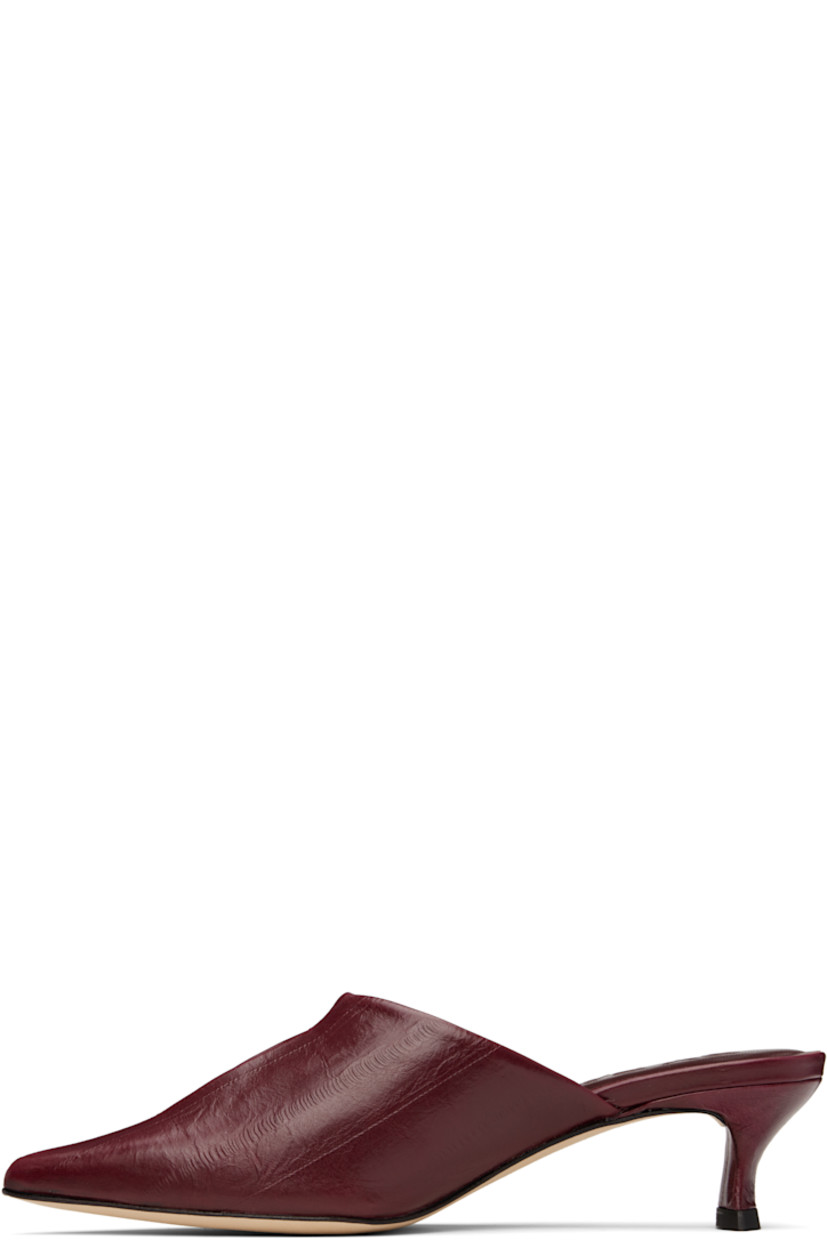 Eel-embossed lambskin mules in burgundy.

· Pointed toe
· Cutout at vamp
· Covered kitten heel with rubber injection
· Logo embossed at footbed
· Nubuck sole
· Heel: H2.25"

Supplier color: Sour cherry
