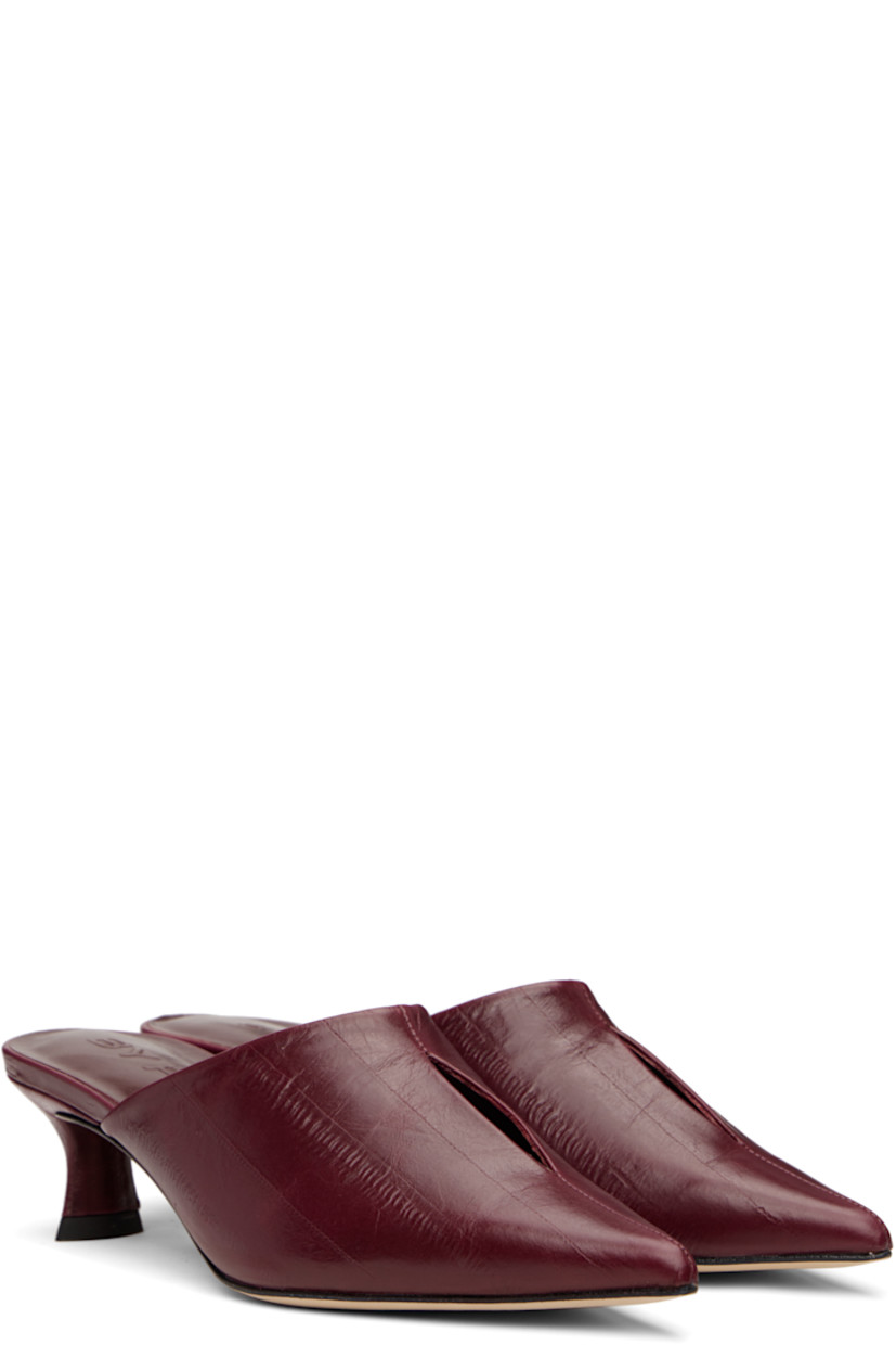 Eel-embossed lambskin mules in burgundy.

· Pointed toe
· Cutout at vamp
· Covered kitten heel with rubber injection
· Logo embossed at footbed
· Nubuck sole
· Heel: H2.25"

Supplier color: Sour cherry
