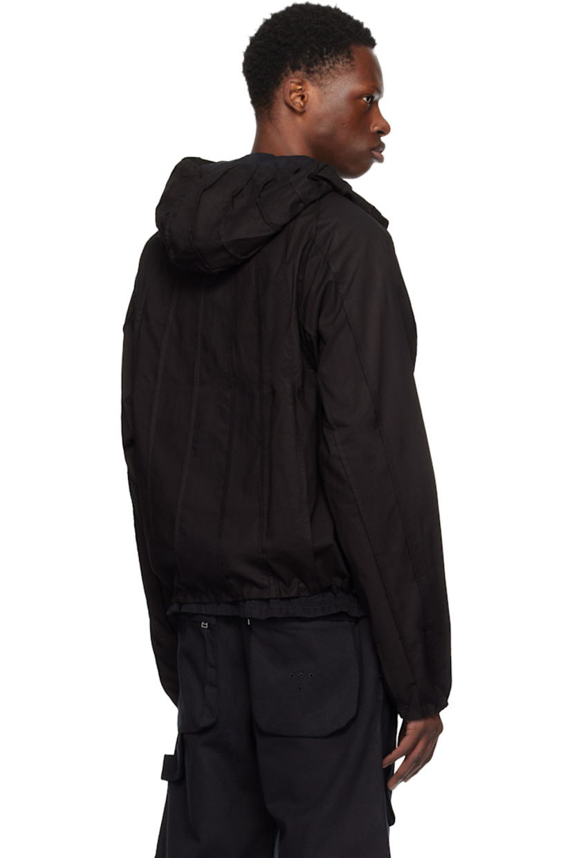 Plain-woven cotton jacket. Pinched seams throughout.

· Hood at stand collar
· Concealed zip closure
· Seam pockets
· Concealed bungee-style drawstring at hem and cuffs
· Raglan sleeves
· Full broadcloth lining

Supplier color: Meteorite