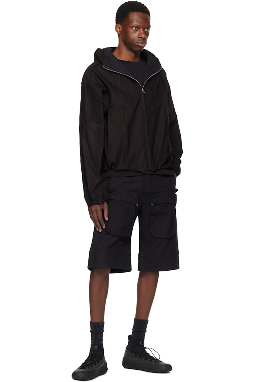 Plain-woven cotton jacket. Pinched seams throughout.

· Hood at stand collar
· Concealed zip closure
· Seam pockets
· Concealed bungee-style drawstring at hem and cuffs
· Raglan sleeves
· Full broadcloth lining

Supplier color: Meteorite