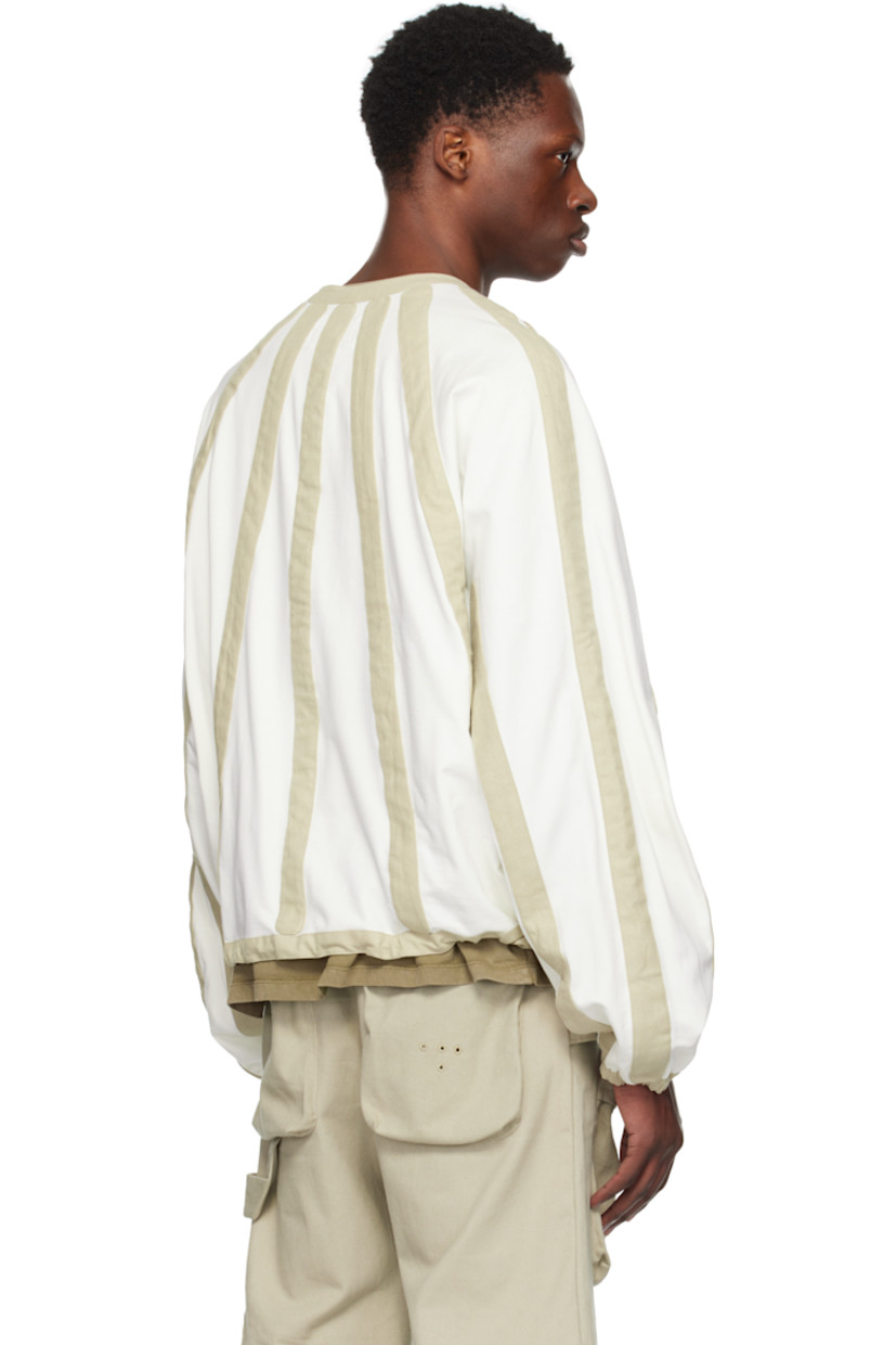 French terry cardigan. Hopsack stripe panels throughout.

· Round neck
· Zip closure
· Concealed bungee-style drawstring at hem
· Raglan sleeves
· Elasticized cuffs

Supplier color: Cloud dancer