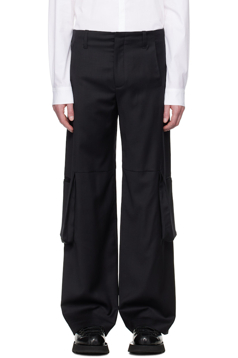 Stretch RWS-certified wool twill cargo pants.

· Belt loops
· Four-pocket styling
· Zip fly
· Bellows cargo pockets with magnetic tabs
· Partial satin lining

Supplier color: Black