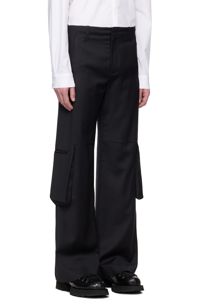 Stretch RWS-certified wool twill cargo pants.

· Belt loops
· Four-pocket styling
· Zip fly
· Bellows cargo pockets with magnetic tabs
· Partial satin lining

Supplier color: Black