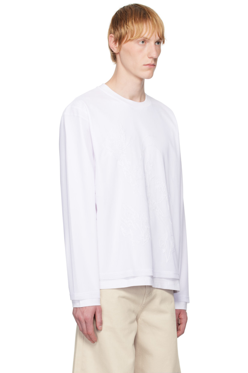 Stretch cotton jersey T-shirt. Integrated stretch polyester mesh overlay.

· Layered construction
· Rib-knit crewneck
· Graphic embroidered at front

Supplier color: White