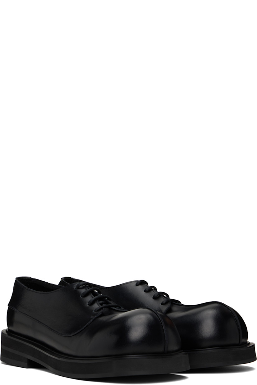 Handcrafted polished calfskin derbys in black.

· Pinched seam at vamp
· Lace-up closure
· Buffed leather lining
· Stacked foam rubber heel and midsole
· Vibram® rubber sole
· Heel: H1.5"

Supplier color: Plane black