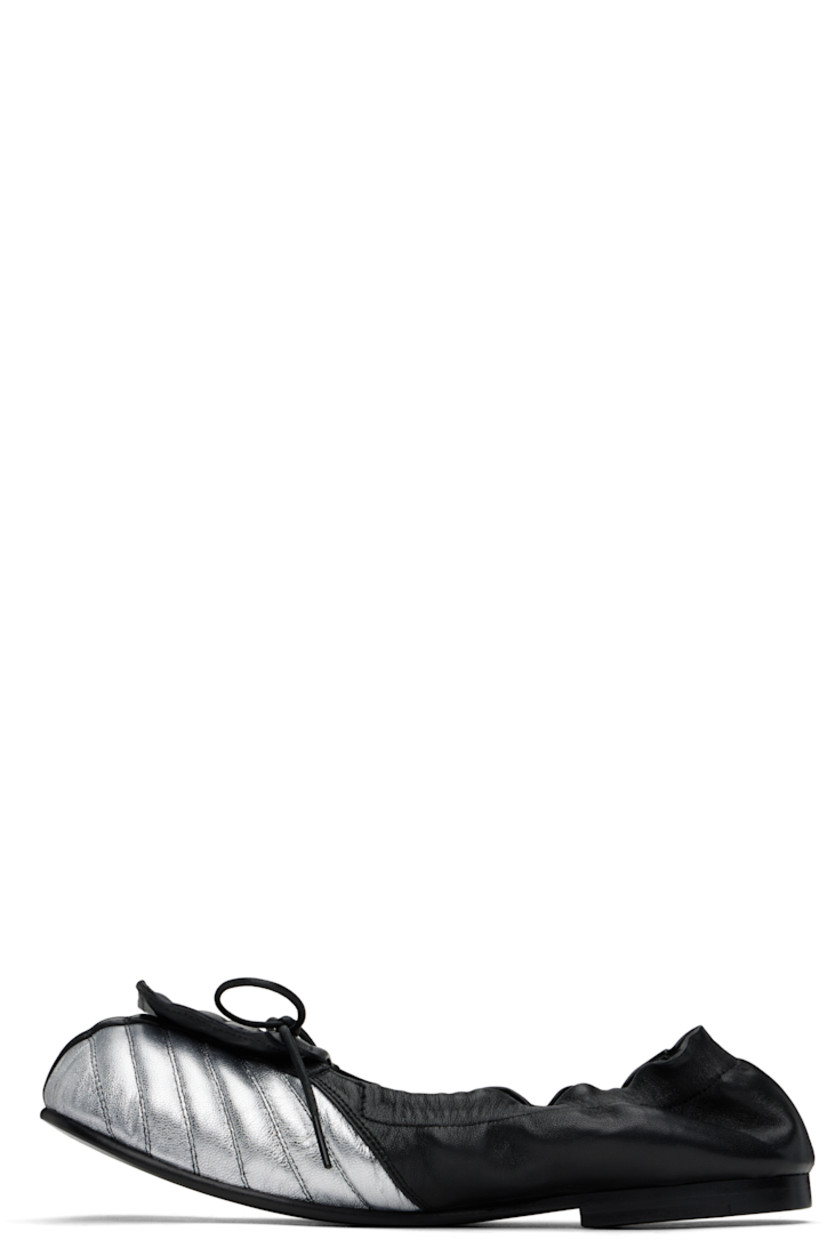 Buffed sheepskin loafers in black and metallic silver tone. 

· Quilted detailing at square toe
· Patch and bow accent at vamp
· Elasticized collar
· Grained leather lining
· Stacked leather heel with rubber injection
· Leather sole

Supplier color: Black/Silver