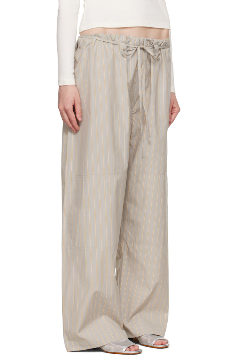 Cotton poplin lounge pants. Stripes throughout.

· Paneled construction
· Drawstring at waistband
· Belt loops at front
· Patch pocket at leg and back
· Cutout at sides

Supplier color: Grey stripe
