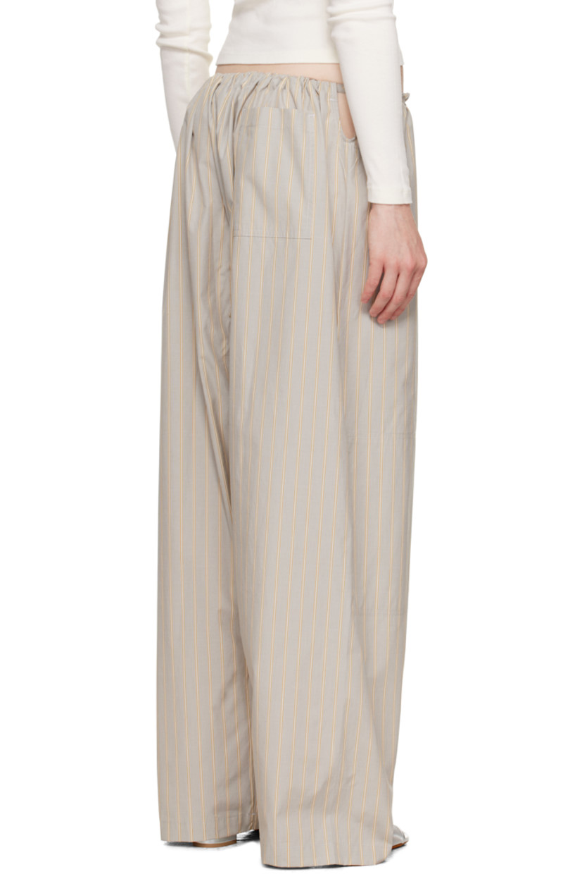 Cotton poplin lounge pants. Stripes throughout.

· Paneled construction
· Drawstring at waistband
· Belt loops at front
· Patch pocket at leg and back
· Cutout at sides

Supplier color: Grey stripe