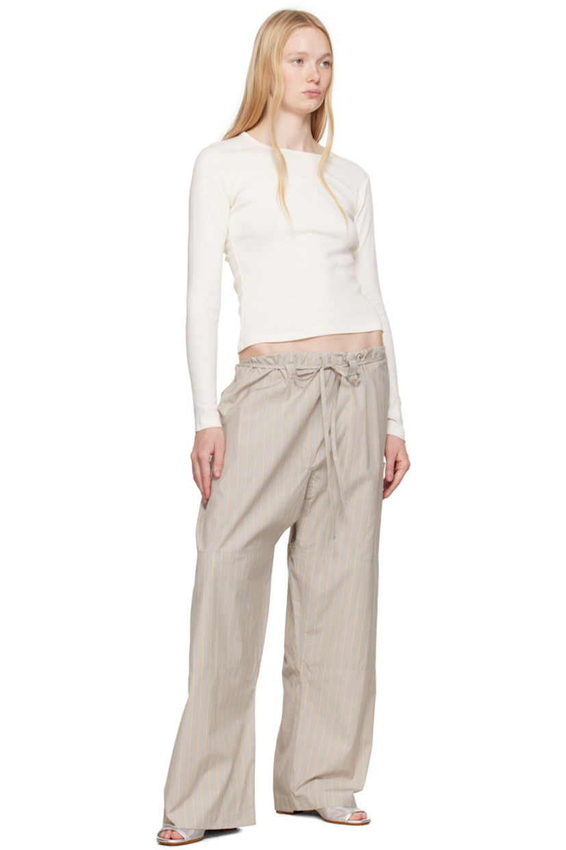 Cotton poplin lounge pants. Stripes throughout.

· Paneled construction
· Drawstring at waistband
· Belt loops at front
· Patch pocket at leg and back
· Cutout at sides

Supplier color: Grey stripe