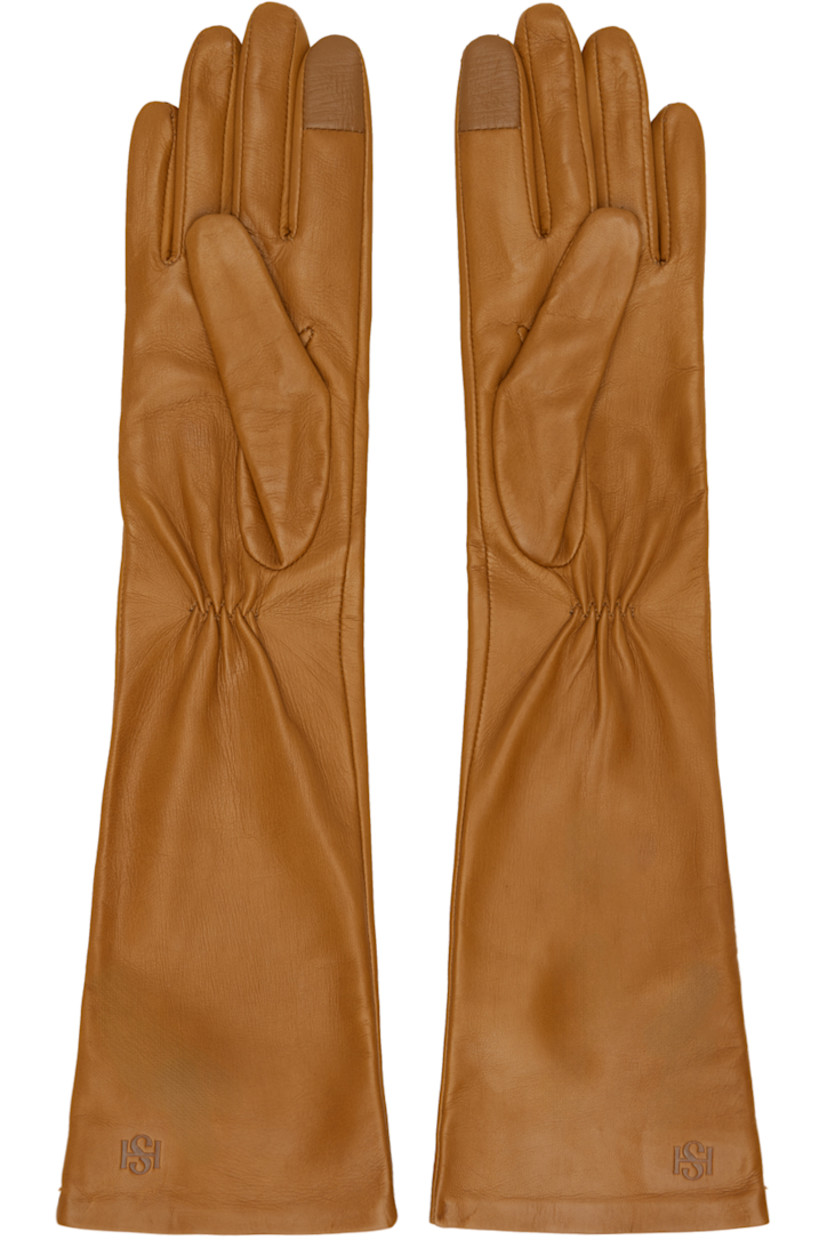 Nappa leather gloves in tan.

· Gathering and embossed logo at cuff
· Touchscreen compatible index finger
· Silk jersey lining

Supplier color: Cognac