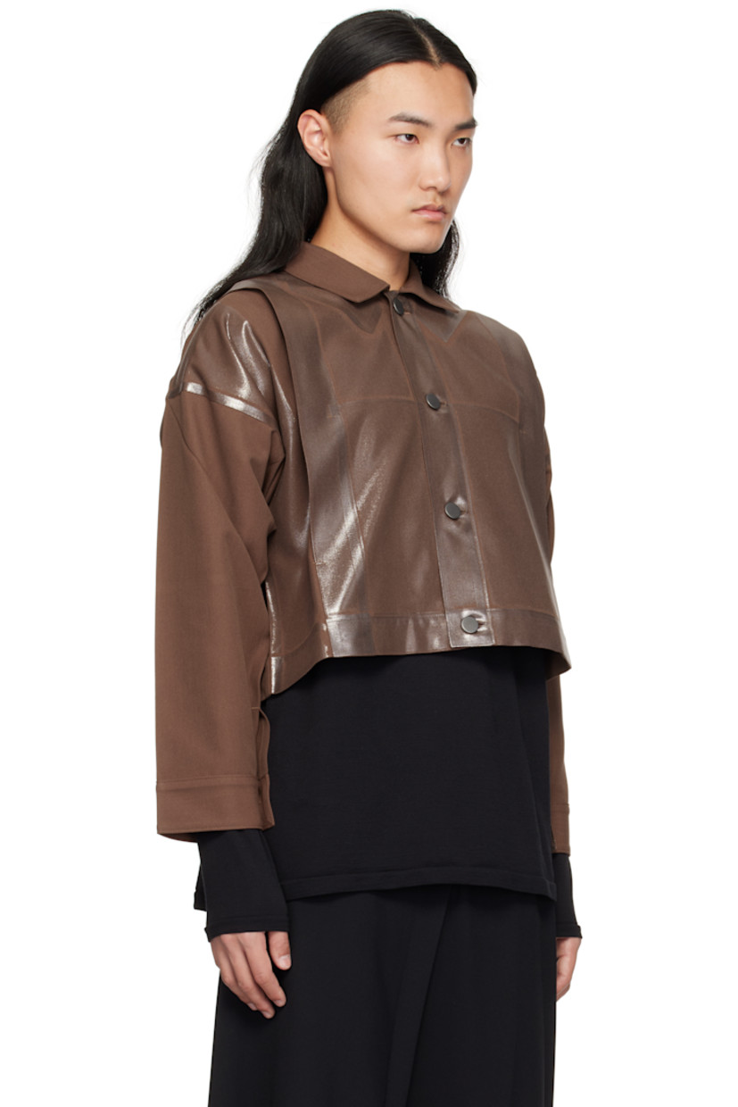 Foiled-coated polyester- and cotton-blend twill jacket. 

· Spread collar 
· Button closure
· Tucks at front and back
· Seam pockets
· Dropped shoulders 
· Single-button barrel cuffs
· Unlined

Supplier color: Brown