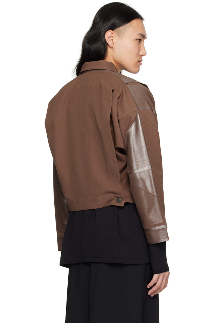 Foiled-coated polyester- and cotton-blend twill jacket. 

· Spread collar 
· Button closure
· Tucks at front and back
· Seam pockets
· Dropped shoulders 
· Single-button barrel cuffs
· Unlined

Supplier color: Brown