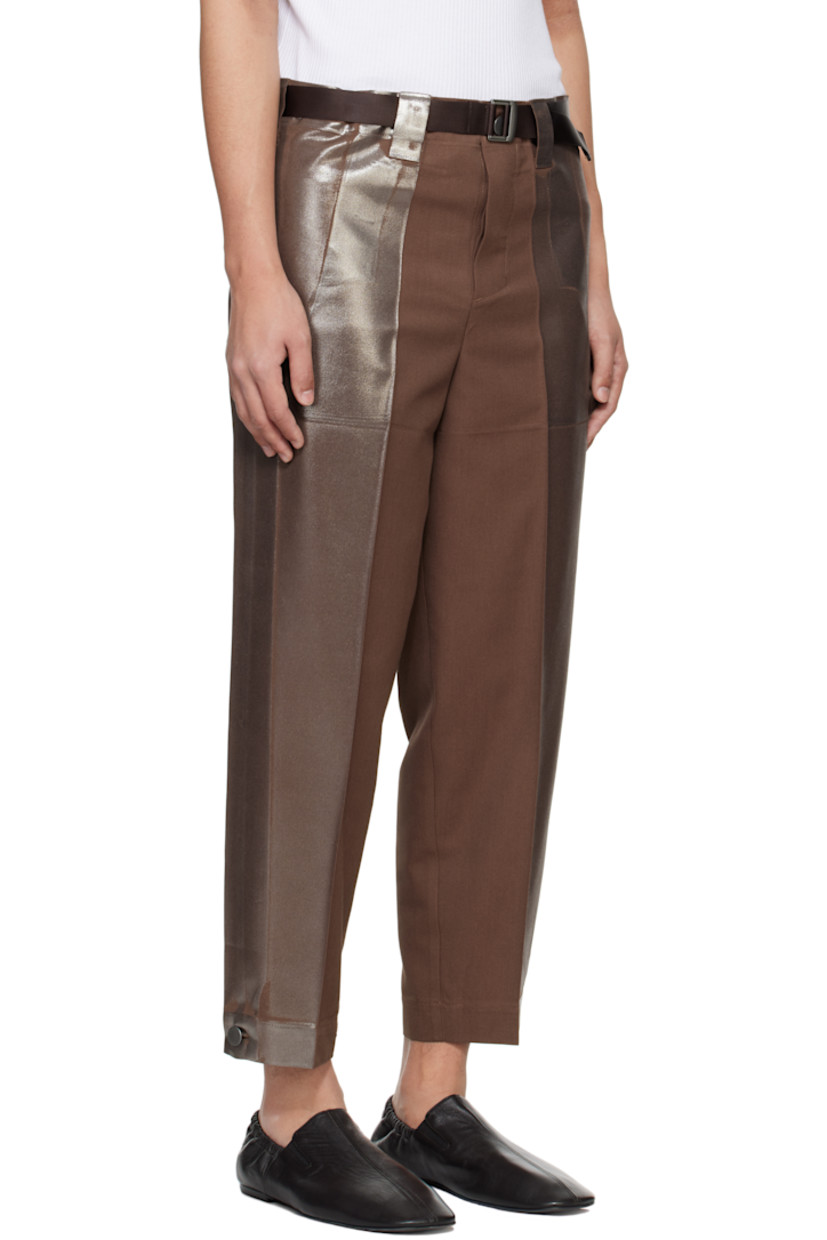 Foil-coated polyester- and cotton-blend twill trousers.

· Tapered leg
· Belt loops
· Detachable webbing cinch belt
· Two-pocket styling
· Button fly
· Creased legs
· Button fastening at cuffs
· Tuck at outseams

Supplier color: Brown