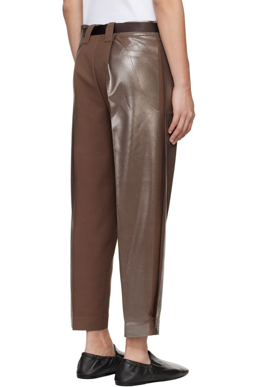 Foil-coated polyester- and cotton-blend twill trousers.

· Tapered leg
· Belt loops
· Detachable webbing cinch belt
· Two-pocket styling
· Button fly
· Creased legs
· Button fastening at cuffs
· Tuck at outseams

Supplier color: Brown