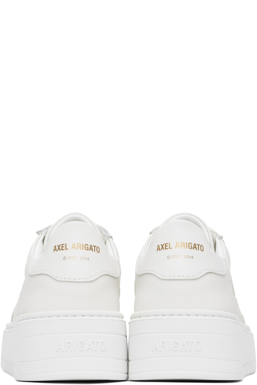 Handcrafted low-top LWG-certified buffed leather sneakers in white.

· Perforations at toe
· Lace-up closure
· Padded tongue and collar 
· Logo stamp at outer side and heel tab 
· Buffed leather and faux-suede lining
· Logo embossed at platform rubber midsole
· Treaded rubber sole
· Platform: H1.75"

Supplier color: White/White