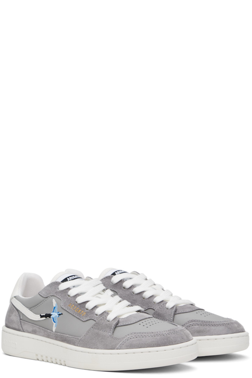 Handcrafted low-top buffed leather and suede sneakers in gray.

· Perforations at toe
· Lace-up closure
· Logo patch at SEAQUAL® YARN recycled canvas tongue
· Padded tongue and collar 
· Logo embossed at outer side and heel tab 
· Embroidered graphic  at outer side 
· Mesh and faux-suede lining
· Logo embossed at rubber midsole
· Treaded rubber sole

Supplier color: Grey/White