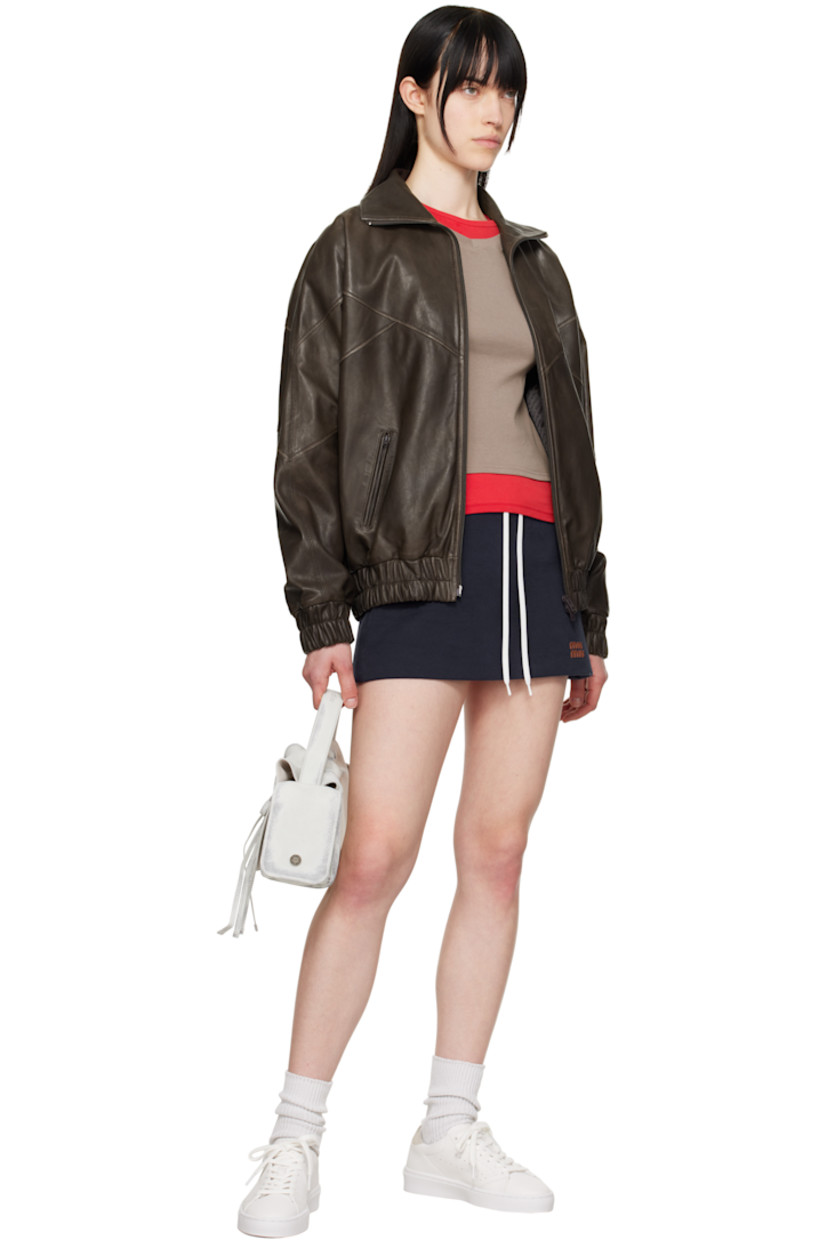Handcrafted low-top LWG-certified buffed leather sneakers in white.

· Lace-up closure
· Logo stamp at padded tongue
· Padded collar
· Logo stamp at outer side
· Perforations at sides
· Suede trim at heel tab
· Buffed leather and faux-suede lining
· Logo embossed at rubber midsole
· Treaded rubber sole

Supplier color: White/Taupe