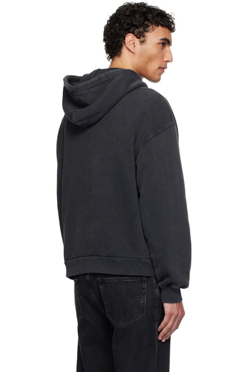 Organic cotton French terry hoodie. Fading throughout.

· Drawstring at hood
· Logo patch at kangaroo pocket
· Rib-knit hem and cuffs
· Dropped shoulders

Supplier color: Black