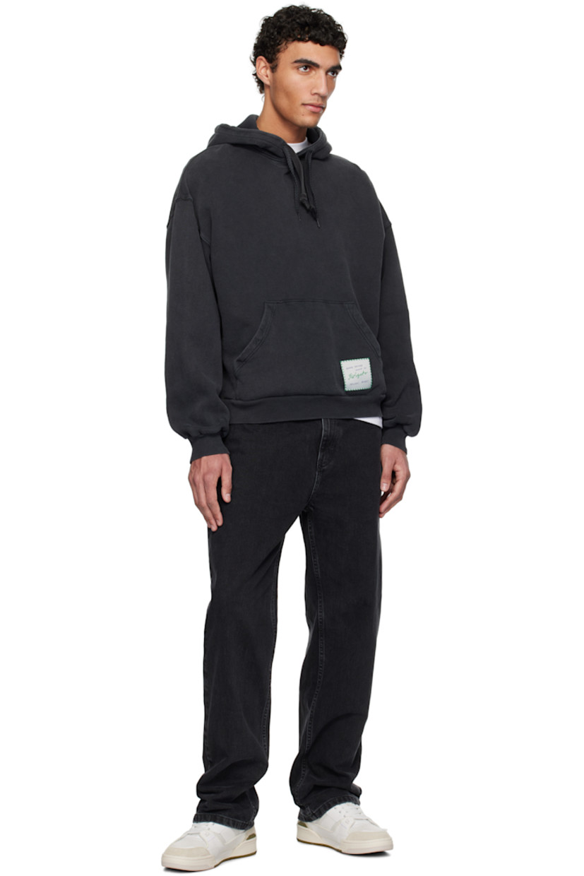 Organic cotton French terry hoodie. Fading throughout.

· Drawstring at hood
· Logo patch at kangaroo pocket
· Rib-knit hem and cuffs
· Dropped shoulders

Supplier color: Black