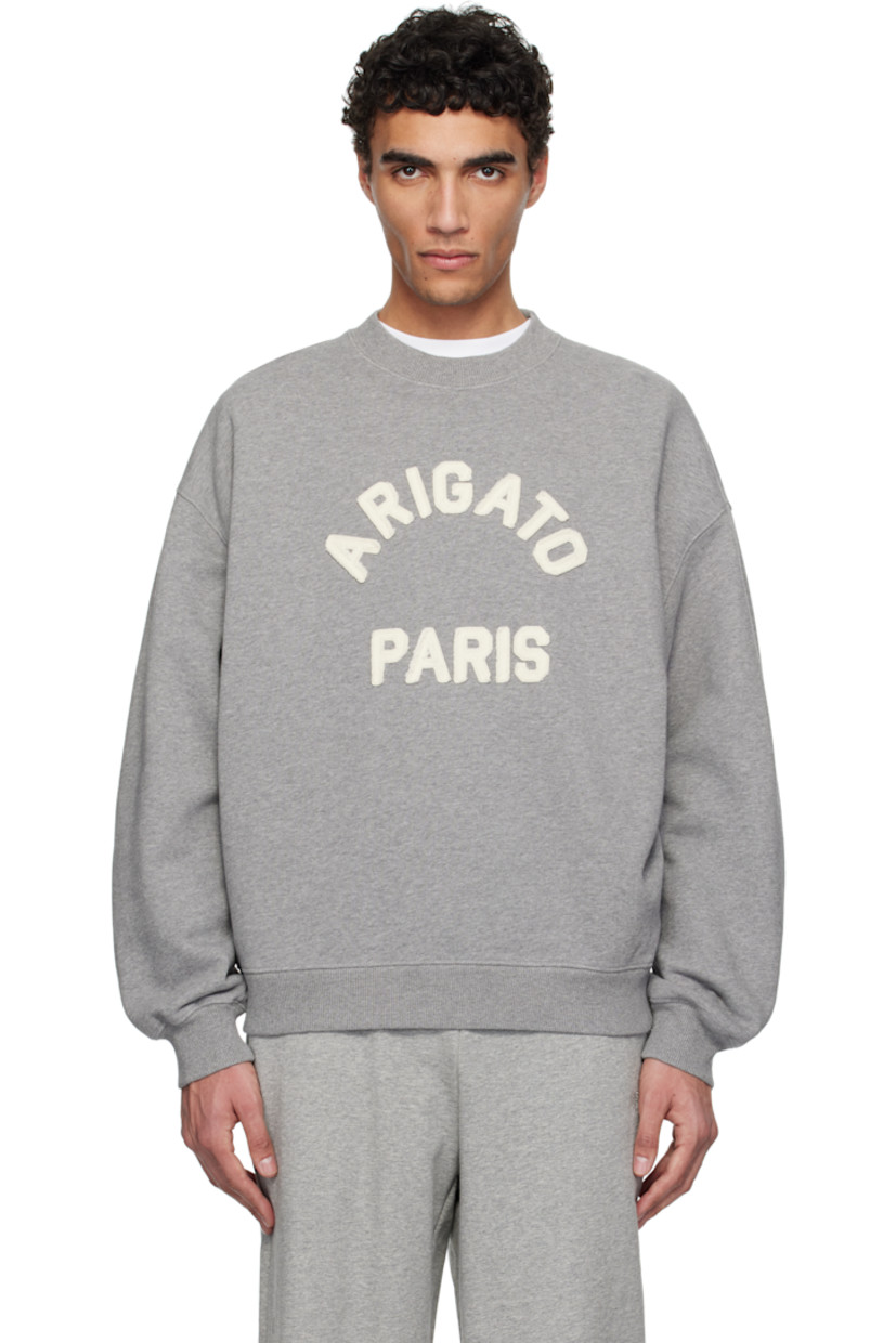 Organic cotton French terry sweatshirt.

· Rib-knit crewneck, hem, and cuffs
· Logo and text appliqués at front
· Dropped shoulders

Supplier color: Grey melange