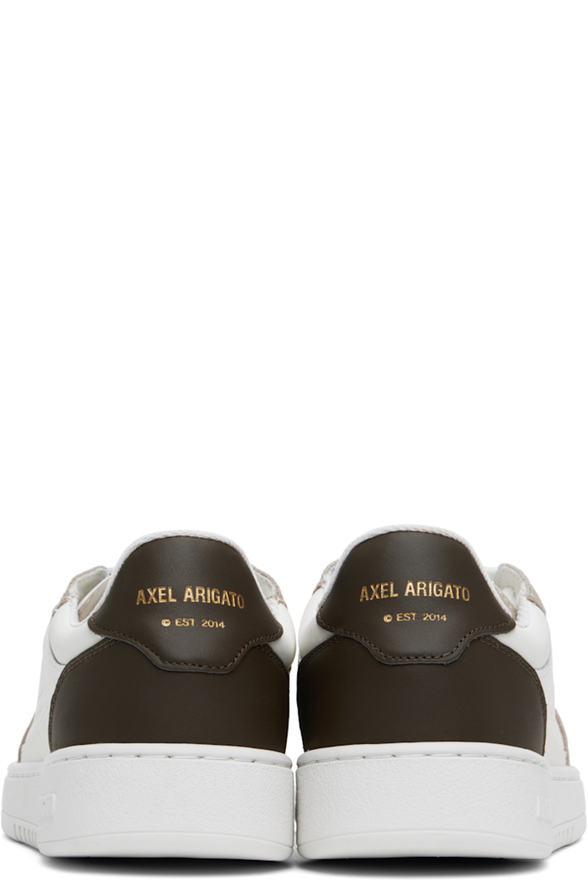 Handcrafted low-top buffed and grained leather sneakers in white and taupe. 

· Perforated detailing at toe and sides
· Lace-up closure
· Logo patch at padded tongue
· Logo stamp at outer side and heel tab
· Recycled mesh lining
· Logo embossed at crêpe rubber midsole
· Treaded rubber sole

Supplier color: White/Dark brown