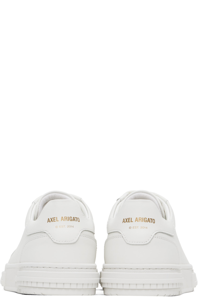 Handcrafted low-top buffed leather sneakers in white. 

· Lace-up closure
· Padded tongue and collar
· Logo stamp at outer side and heel tab
· Buffed leather and suede lining
· Logo embossed at textured rubber midsole
· Treaded rubber sole

Supplier color: White