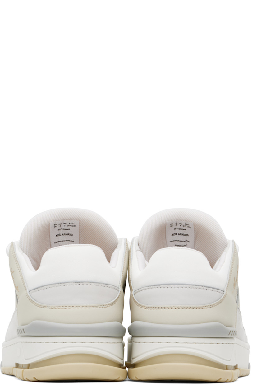 Low-top LWG-certified buffed leather and recycled polyester canvas sneakers in white and beige.

· Handcrafted
· Perforated detailing throughout
· Lace-up closure
· Logo patch at padded tongue
· Padded collar
· Logo stamp at outer side
· Rubber trim at heel counter
· Removable cushioned footbed
· Recycled mesh lining
· Logo embossed at midsole
· Treaded rubber sole

Supplier color: Cremino/White