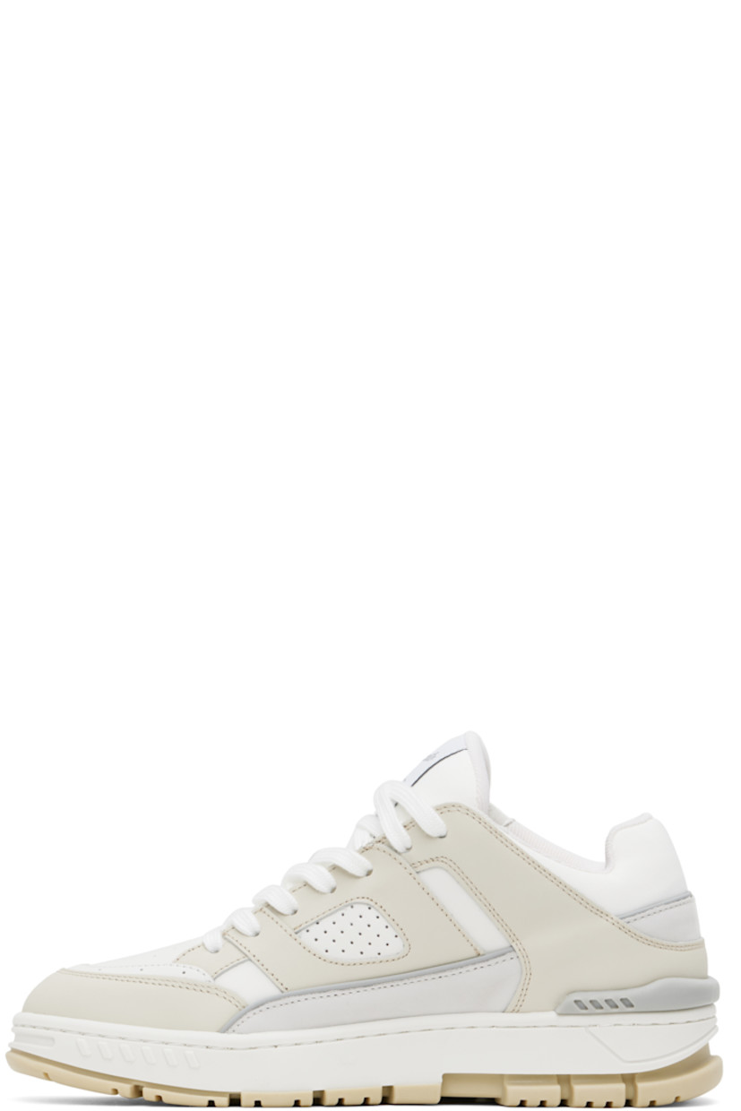 Low-top LWG-certified buffed leather and recycled polyester canvas sneakers in white and beige.

· Handcrafted
· Perforated detailing throughout
· Lace-up closure
· Logo patch at padded tongue
· Padded collar
· Logo stamp at outer side
· Rubber trim at heel counter
· Removable cushioned footbed
· Recycled mesh lining
· Logo embossed at midsole
· Treaded rubber sole

Supplier color: Cremino/White