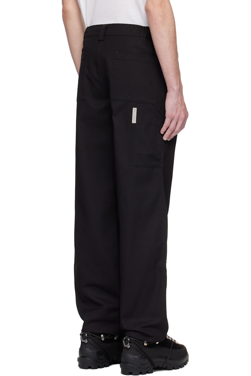 Cotton-blend drill trousers.

· Belt loops at partially elasticized waistband
· Four-pocket styling
· Zip fly
· Raw edge at cuffs
· Patch pocket and logo flag at back leg

Supplier color: Black