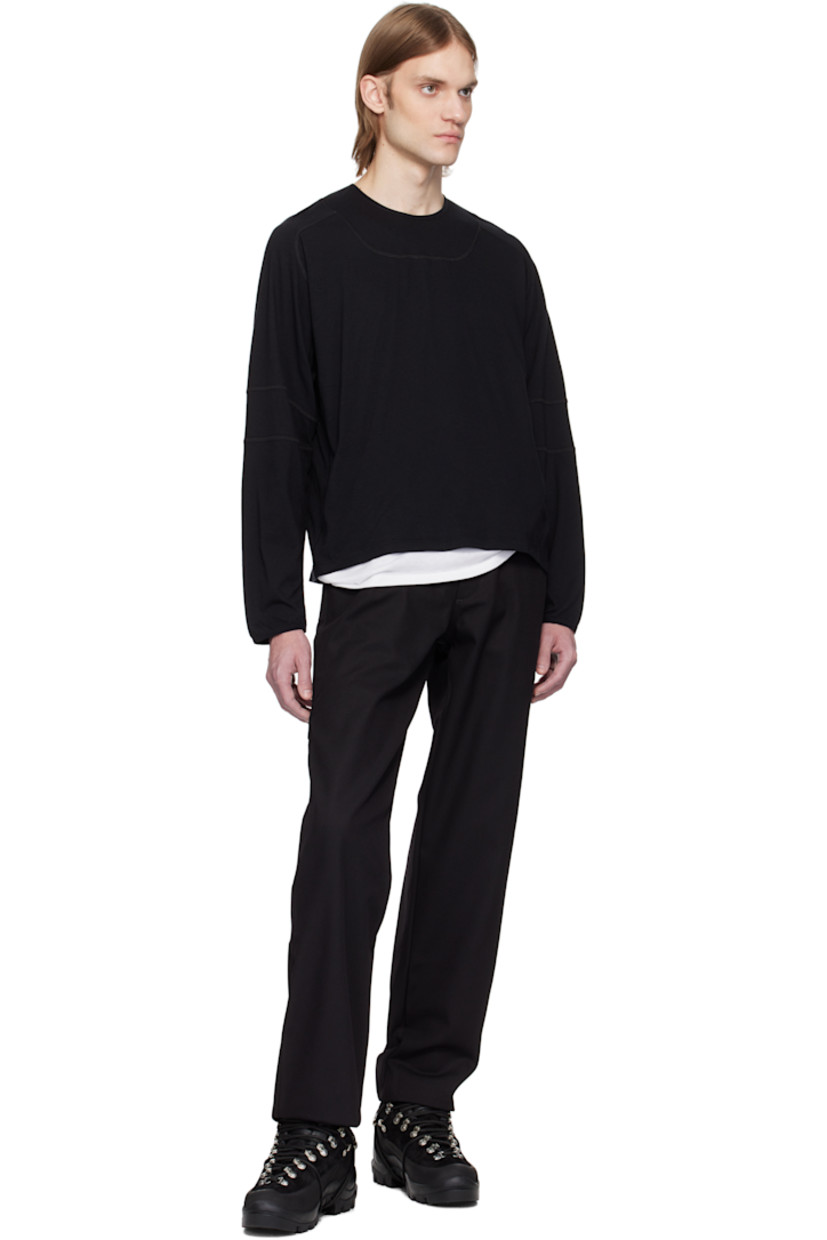 Cotton-blend drill trousers.

· Belt loops at partially elasticized waistband
· Four-pocket styling
· Zip fly
· Raw edge at cuffs
· Patch pocket and logo flag at back leg

Supplier color: Black