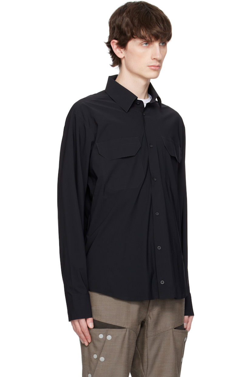Stretch nylon jersey shirt. Laser-cut raw edges and taped seams throughout.

· Spread collar
· Button closure 
· Flap pockets at chest
· Logo embroidered at shirttail hem
· Barrel cuffs
· Twin pleats at back yoke

Supplier color: Black